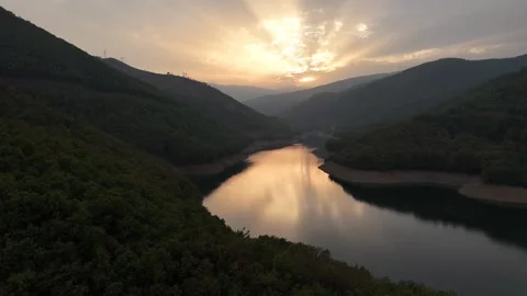 Drone sunset video, sunbeams reflection on lake Stock Footage 295434362