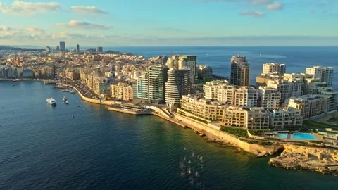Drone sunset view of buildings in Sliema coastline. Malta. Mediterranean sea Stock Footage 330178682