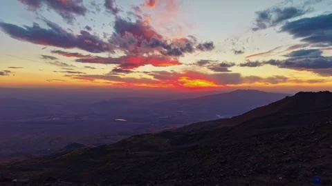 Drone sunset view from Mount Ararat base camp at 3200m with vibrant orange sky Видео 333200852