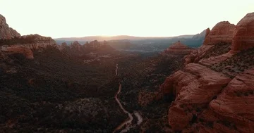 Drone Sunset View of a Winding Path in Sunset Mountains Video stock 85754151