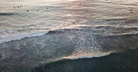 Drone of Surfers in Pacific Ocean at Sunset in Pacific Beach San Diego, CA Stockbeeldmateriaal 95905897