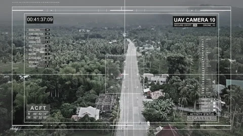 A drone with a surveillance camera flies over the jungle and the highway. Stock Footage 96734489