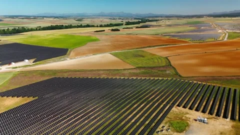 Drone Sweep Across Solar Parks in a Rural Valley 動画素材 344705729