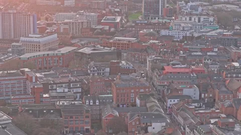 Drone sweeps across the dense red-brick rooftops and historic street patterns Stock Footage 324406302