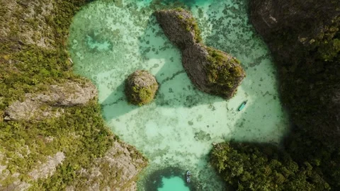 Drone table top shot around a cliffs, turquoise water in Raja Ampat Stock Footage 260022962