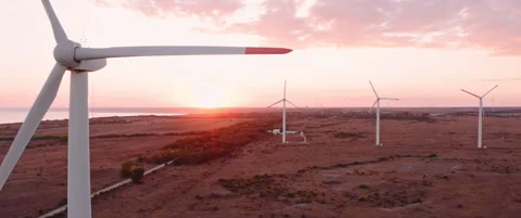 Drone take off Aerial view of wind turbines farm in sunset time. 2.39 scope Stock Footage 247845963