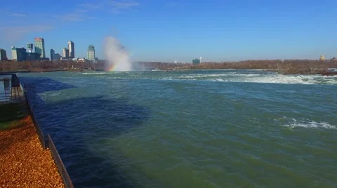 Drone take off and flight above Niagara River towards waterfalls Stock Footage 64888946