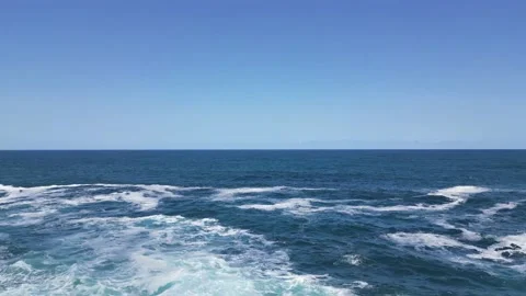 Drone take off from cliff and fly into the sea Stock Footage 229506649