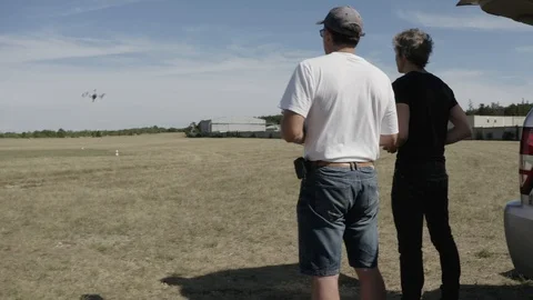 Drone take off during mission with instructor and operator Stock Footage 112631266