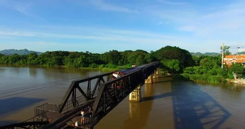 Drone take vdo during train crossing river Kwai  Stock Footage 79860029