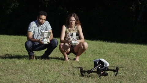 Drone Takeoff Super Slow Motion With Young Attractive Man and Woman In The Stockbeeldmateriaal 82592261