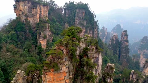 A drone takes a 360-degree view of the Avatar karst erosion mountains with Video stock 339334625