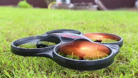 Drone takes off from grass to shoot objects Stock Footage 69856818