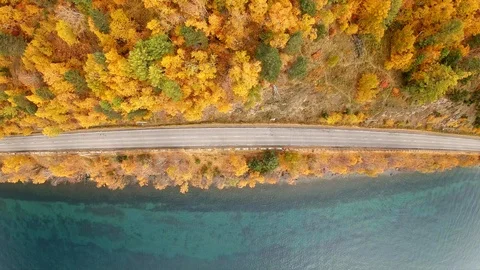 Drone takes off over an empty coastal road in the fall. Aerial vertical shot Stock Footage 123954459