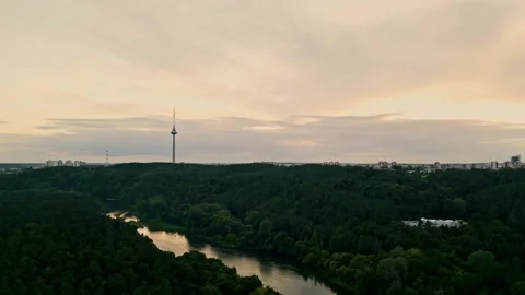 The drone takes off over the park. View of the city and the TV tower 動画素材 251748901