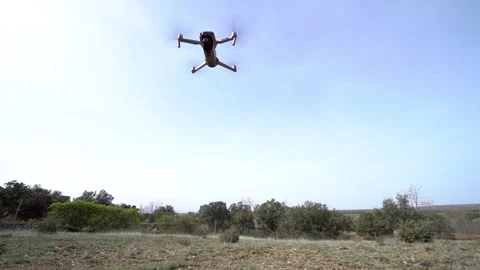 Drone taking off from an airstrip and flying fast into the sky. Stock Footage 188677559