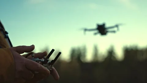 Drone taking off and flying at sunset Stock Footage 330397244