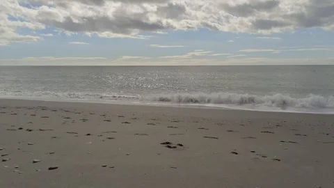 Drone taking off the beach and flying over the sea Stock Footage 119277301