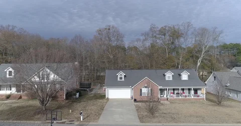 Drone taking off in front of houses Stock Footage 81645011