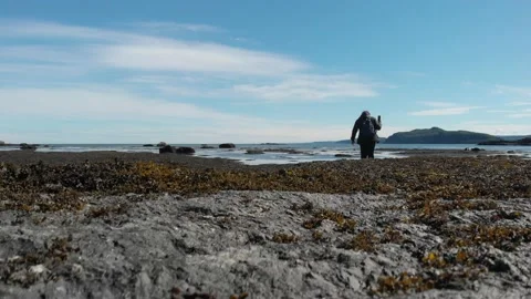 Drone taking off by the ocean Stock Footage 142705599