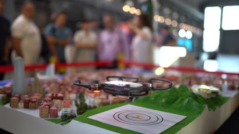 Drone taking off over a scale model of a city. Unmanned aerial vehicle (UAV). Stock Footage 131009917