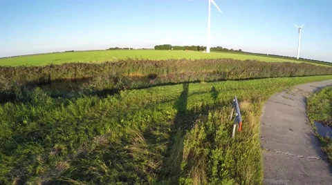 Drone taking off ready to shoot footage of landscape full of wind turbines 4k Stock Footage 54561645