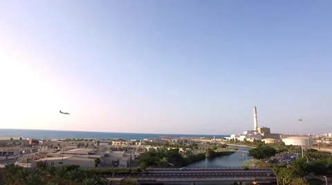 Drone Tel Aviv Harbor with plane landing Stock Footage 55867862