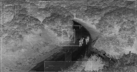 Drone with thermal night vision view of terrorists with camera zooming in Video stock 106682025