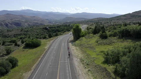 Drone of three road cyclists riding near Jordanelle State Park, Utah. Stock Footage 144460526