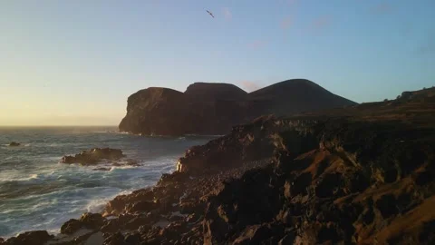 Drone through coastline rocks to a vulcano, Faial island. Azores Stock Footage 303334362