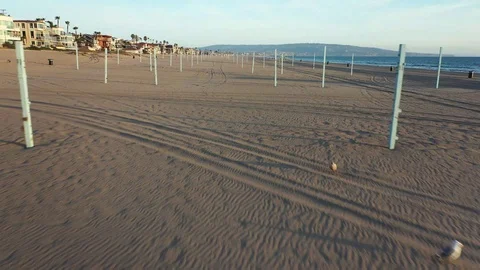 Drone through empty volleyball courts at sunset Video stock 127610187