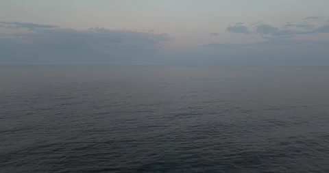 Drone Tilt Down Over Calm Sea Surface Stock Footage 327328964