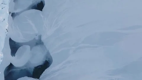 Drone tilt down view while rotating, icelandic winter landscape Stock Footage 327488741