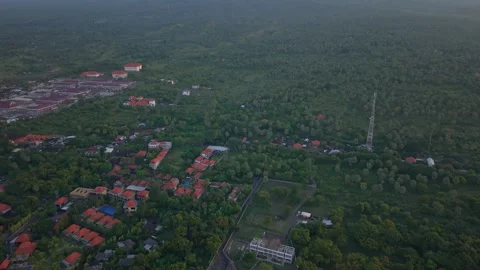 Drone tilt-down from volcano to tropical coastal resort Stock Footage 336100920