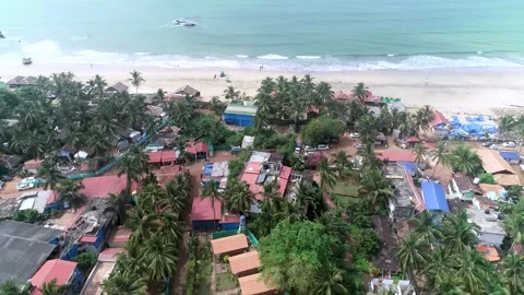 Drone tilt up houses to sky goa 003 Stock Footage 331663107