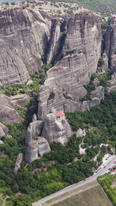 Drone Tilt-Up Over Meteora Cliffs and Monasteries, Vertical Format Stock Footage 322149683