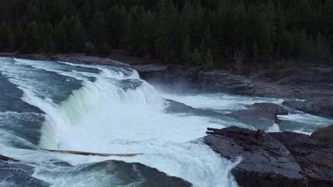 Drone Tilt Over a Waterfall 4K Stock Footage 73058875