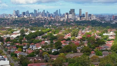 Drone Tilt Up Revealing Sydney CBD Skyline Above Residential Suburbs Stock Footage 344097357
