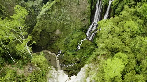 Drone Tilting Down Over Tumpak Sewu Waterfalls Stock Footage 146104436
