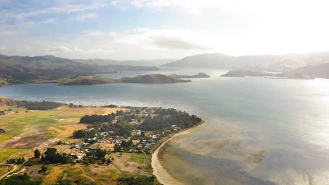 Drone Tilting Up Over A Group Of Small Islands In New Zealand's Dunedin Bay  Stock Footage 234649354