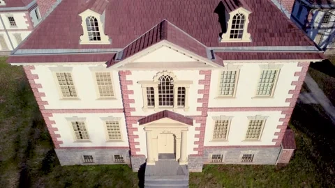 Drone Tilting Up from Walking Path to Top of Historic 1700s Georgian Mansion Video stock 146245279