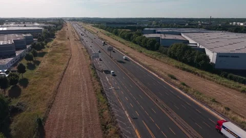 Drone Tilts Down Over A1 Motorway Traffic 動画素材 343096355