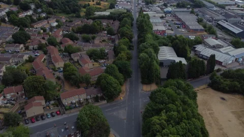 Drone tilts up over road in Burngreave, Sheffield on sunny partly cloudy day Stock Footage 340920079