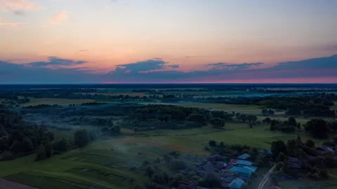 Drone time lapse above a misty village at dawn.  Stock Footage 160363418