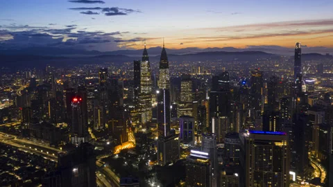 Drone Time lapse : Aerial Kuala Lumpur city view during twilight Stock Footage 195978558