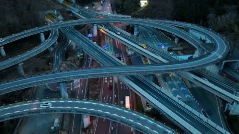 Drone time lapse of busy traffic on elevated highway and convergence of roads in Stock Footage 231450306