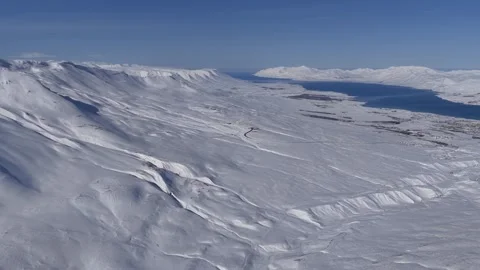 Drone time-lapse flying fast in beautiful Icelandic winter landscape Stock Footage 334580858