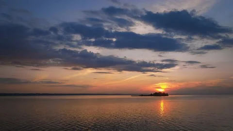 Drone time-lapse of the sea with island at sunset. 4K UHD aerial footage Stock Footage 208519612