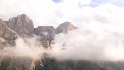 Drone timelapse of clouds covering mountain peaks Stock Footage