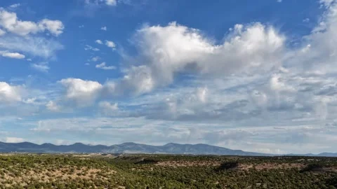 Drone Timelapse of Fast Clouds and Drizzle Over Mesas and Juniper Forest Video stock 337200602